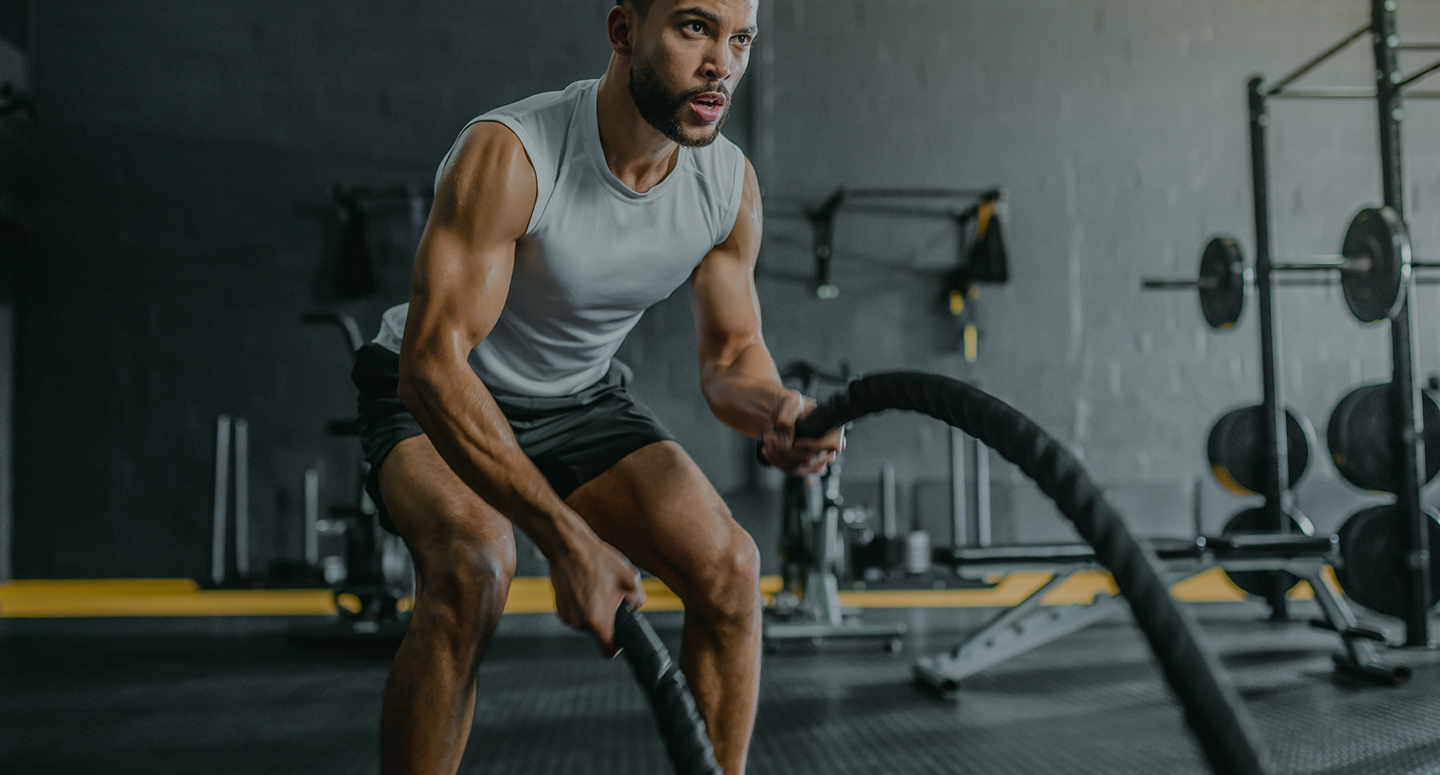Athlete training with battle ropes